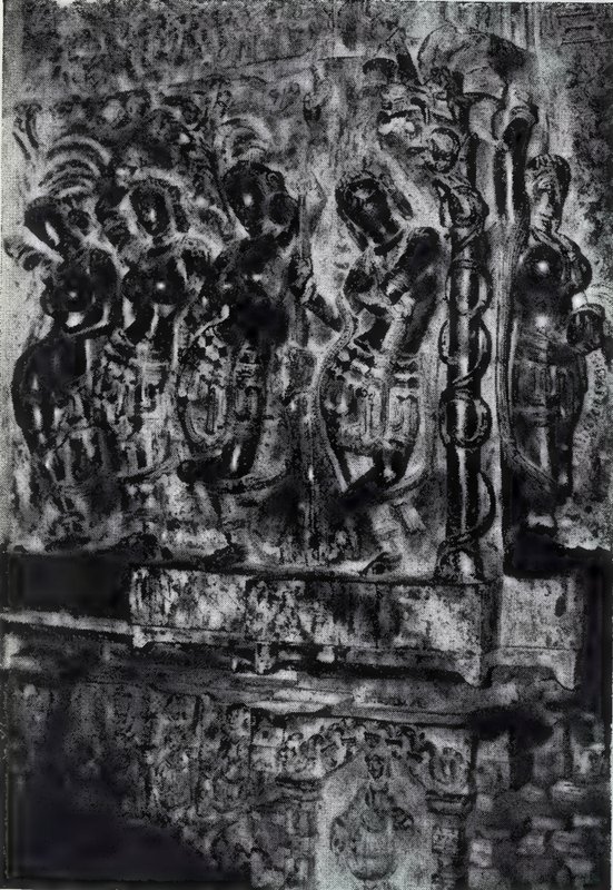 A group of people carved in high relief on a door jamb, with a carved base below.