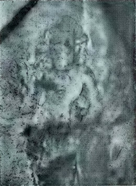 A blurred, mottled photograph of a stone statue. Only the head and upper body are faintly visible.