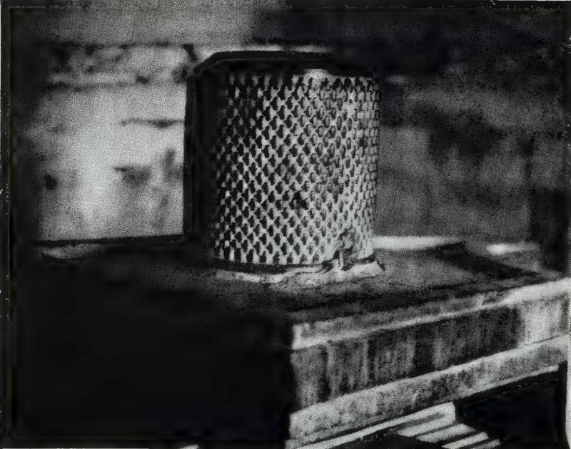 A cylindrical linga covered with a grid of many small carved lingas, on a broad square pedestal.